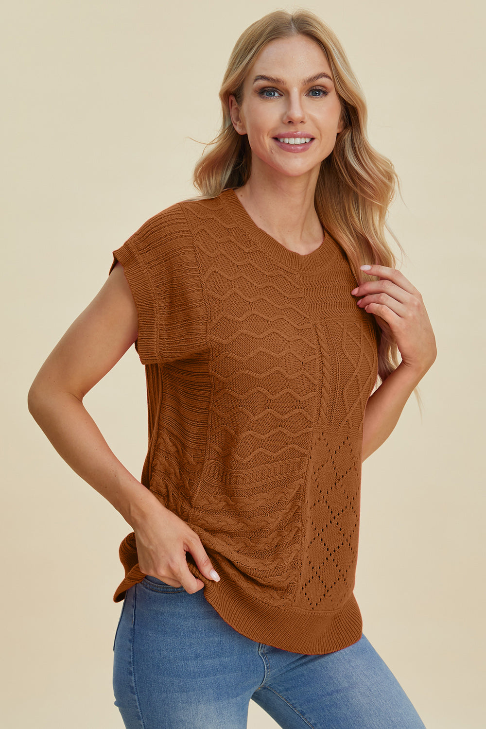 Brown knit patchwork sleeveless top with textured patterns and cable knit details.