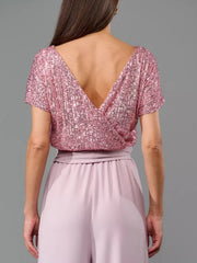 Sequin wrap bodice top with short sleeves and wide leg palazzo pants in dusty pink.