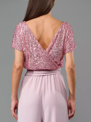 Sequin wrap bodice top with short sleeves and wide leg palazzo pants in dusty pink.