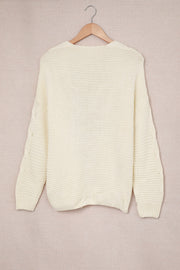 Ivory cable knit acrylic cocoon cardigan with open front and textured sleeves.