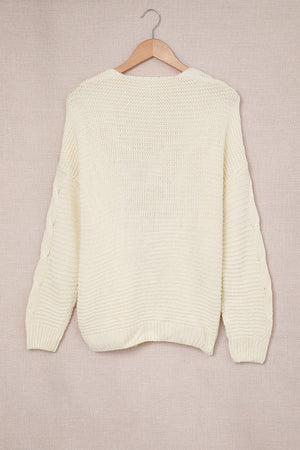 Ivory cable knit acrylic cocoon cardigan with open front and textured sleeves.