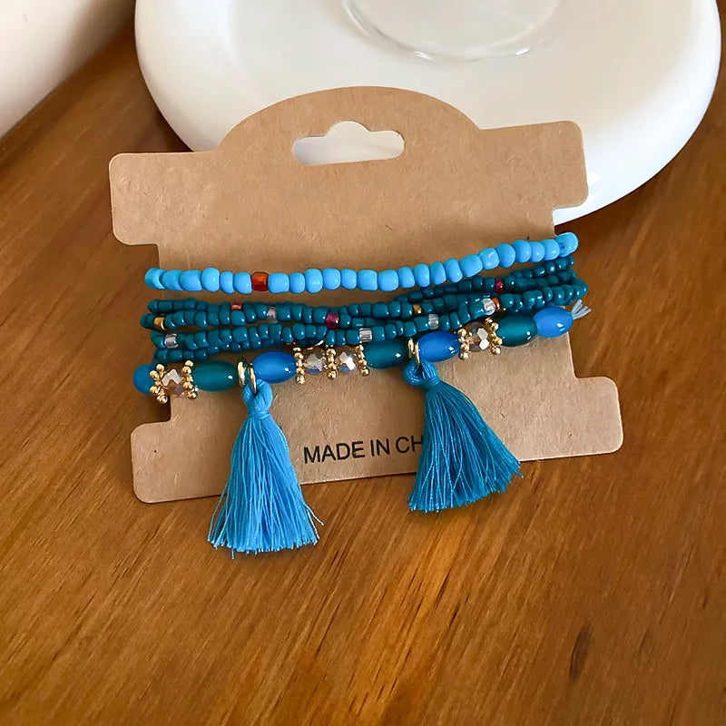 Beaded tassel stacked bracelet set in Royal Blue with gold accents and blue tassels.