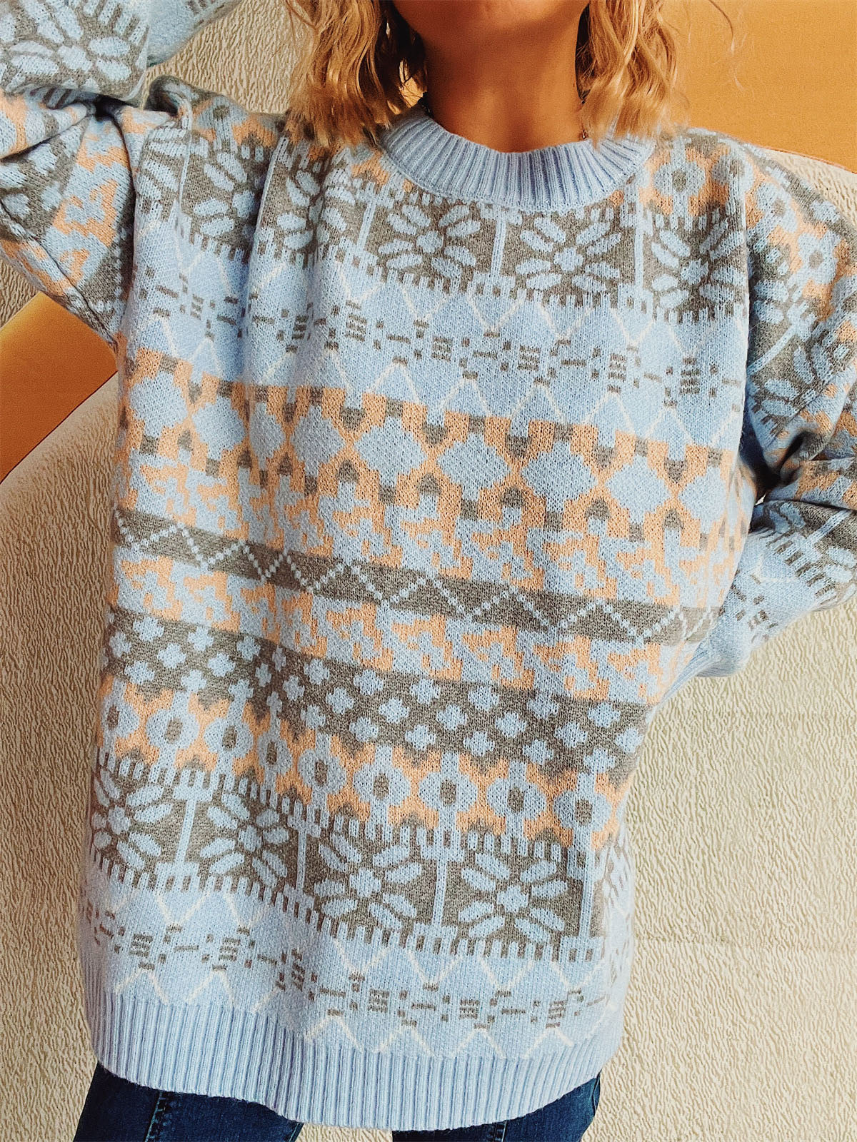 Light blue acrylic Fair Isle knit oversized sweater with crewneck and snowflake pattern.