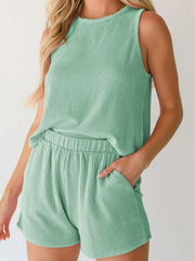 Sleeveless ribbed knit coord set in Gum Leaf green with elastic waist shorts.