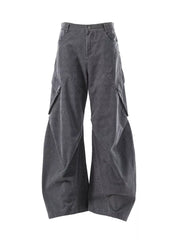 Textured paneled cargo pants in dark gray with a baggy fit and large side pockets.