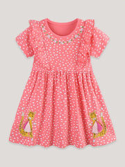 Coral polka dot cotton dress with ruffled sleeves, floral embroidery, and leopard appliques.