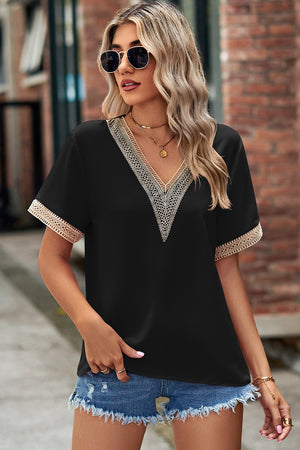 Black V-neck blouse with lace trim on neckline and sleeves