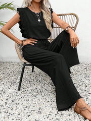 Black textured ruffle sleeve drawstring jumpsuit with wide leg pants