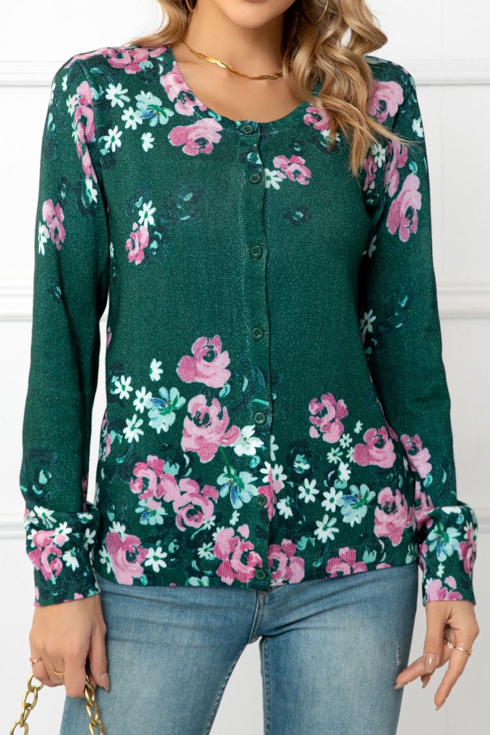 Forest green crewneck cardigan with pink and white botanical print, button front, long sleeves