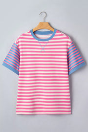 Short sleeve t-shirt with pink and white horizontal stripes, blue striped sleeves, and blue crew neck.