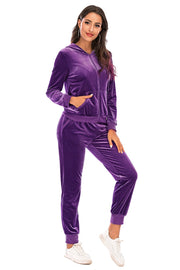 Purple velvet loungewear set with zip-up hoodie and cuffed joggers.