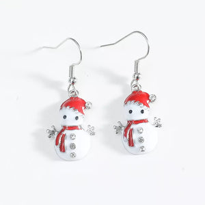 Festive snowman charm drop earrings with red hats, scarves, and crystal accents.