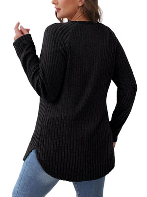 Black ribbed sweater with raglan sleeves and asymmetric hem