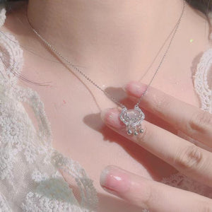 Auspicious lock pendant necklace with chalcedony and silver charms.