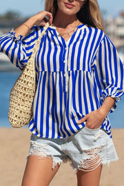 Blue and white striped button-down shirt with balloon sleeves and a tiered hem.