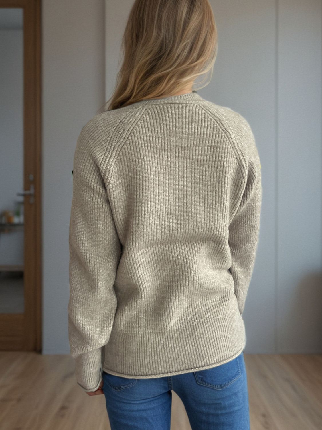 Khaki ribbed knit raglan sweater with crewneck, shown from the back.