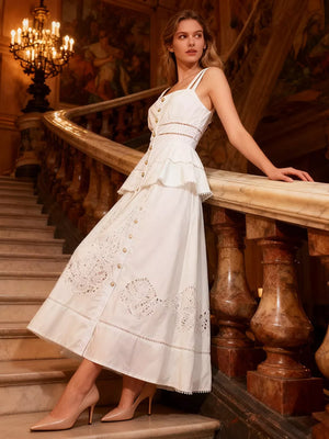 White eyelet embroidered midi dress with button front, cutout waist and tiered hem.