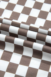 Checkered palazzo jumpsuit in mocha with cap sleeves, shown in a fabric detail view.