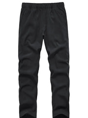 Black men's sweatpants with elastic waistband and side pockets.