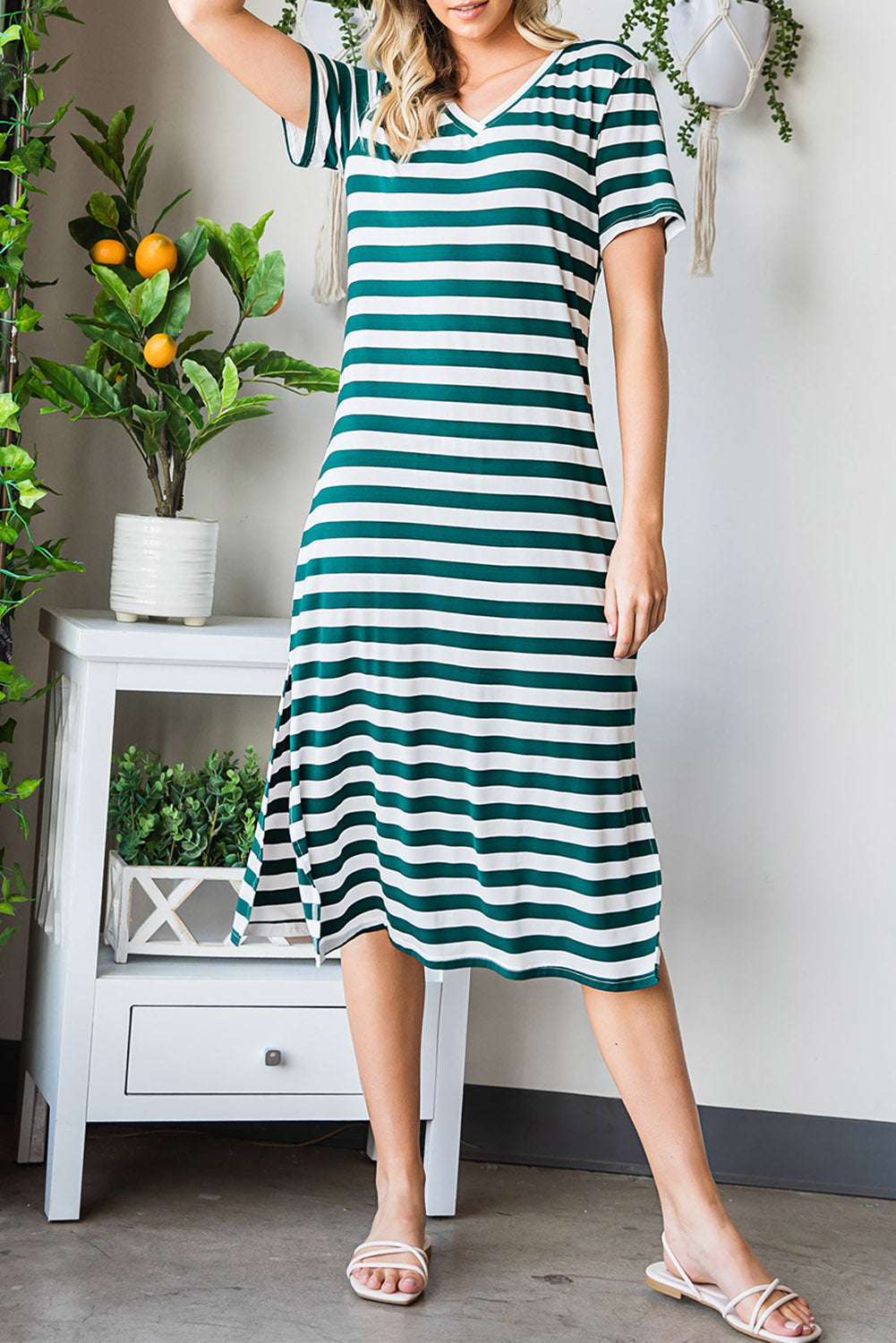 Striped jersey maxi dress with v-neck, short sleeves, and slit hem.