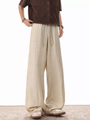 Khaki relaxed fit drawstring sweatpants with wide legs and a comfortable casual style.
