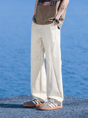 Relaxed fit men's lightweight joggers in apricot with a casual, loose cut.