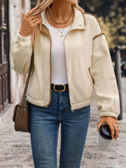 Cream fleece track jacket with contrast trim and zipper closure