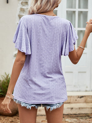 Lavender eyelet blouse with flutter sleeves and a textured pattern.