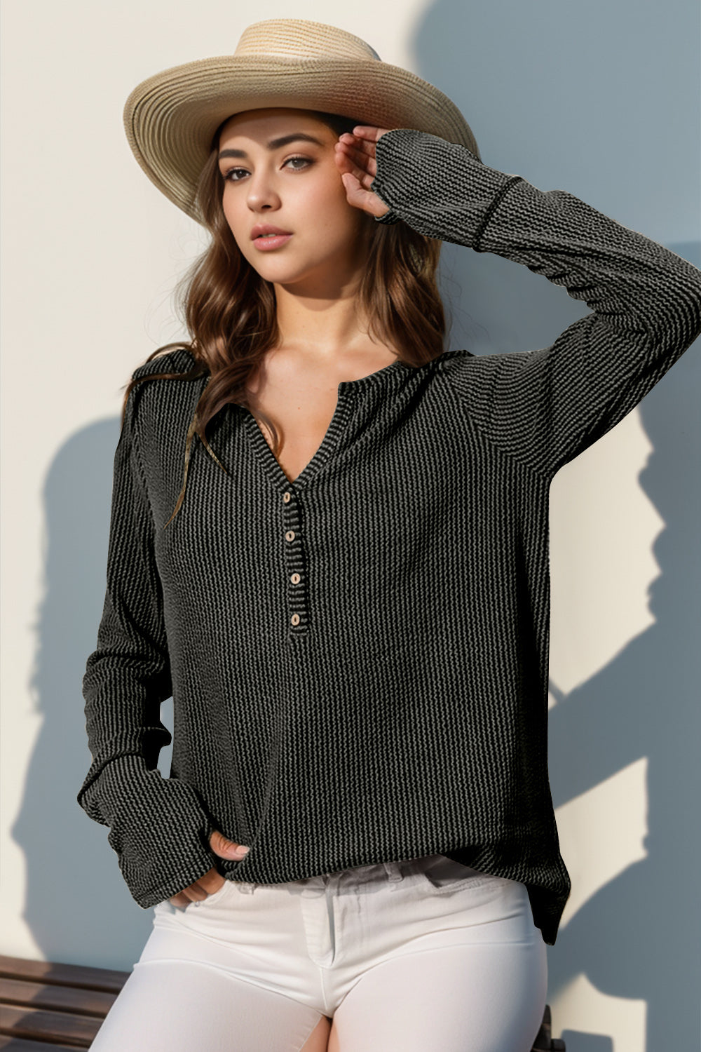 Waffle knit henley shirt in dark gray with button placket and thumbhole cuffs.