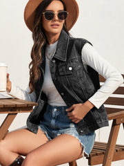 Washed black denim vest with collar and patch pockets, worn by a woman.