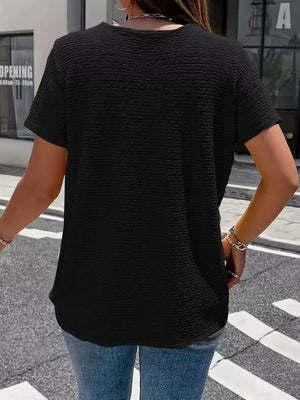 Textured black short sleeve blouse with a crew neck.
