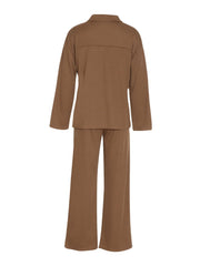 Brown ribbed knit lounge set with relaxed fit long sleeve top and wide leg pants.