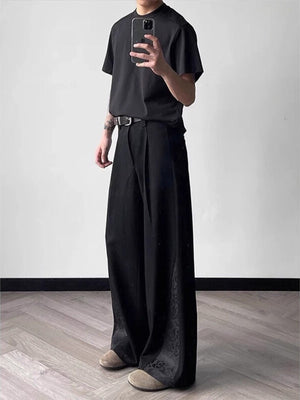 Men's black relaxed fit wide leg trousers with subtle jacquard detail on the hem.