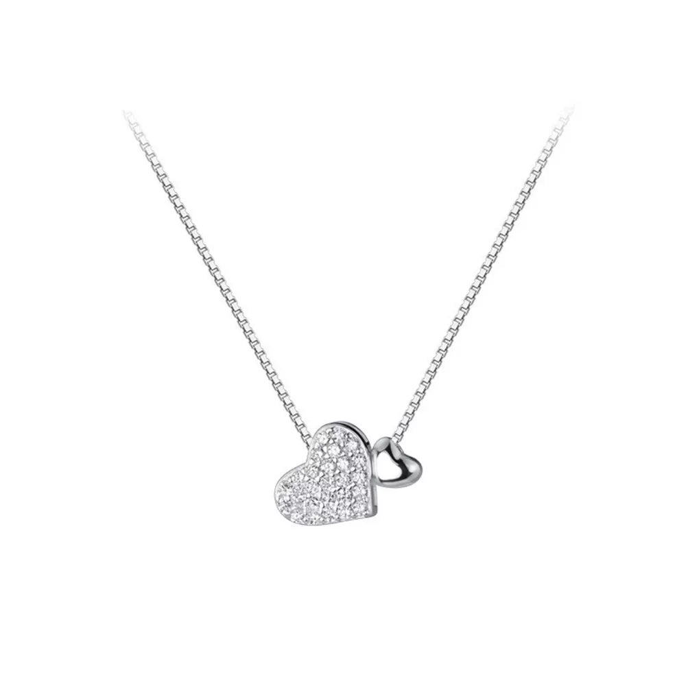 Elegant heart pendant necklace with pave zircon detail on a sterling silver box chain.