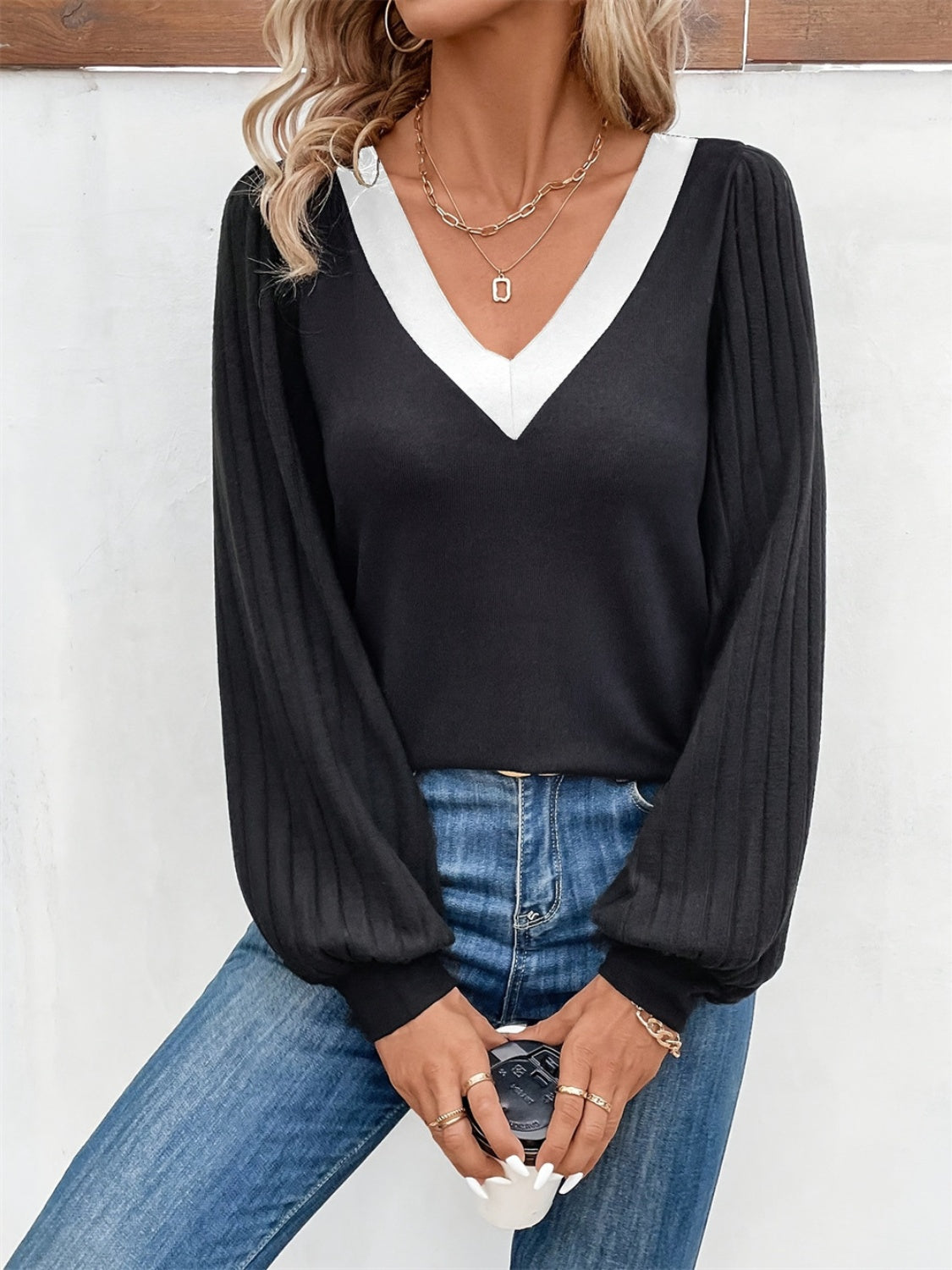 Black ribbed sleeve top with white V-neck contrast collar and balloon sleeves.
