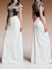 White denim maxi skirt with raw hem and button closure, shown front and back.