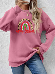 Blush pink crewneck sweatshirt with rainbow Christmas graphic and leopard print detail.