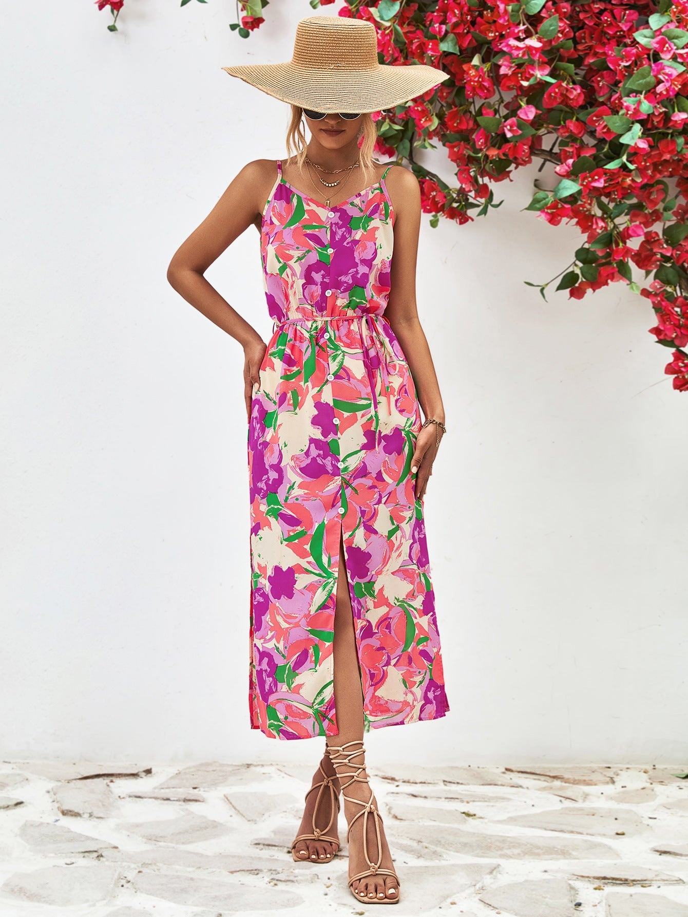 Floral print button-down midi dress with spaghetti straps and a front slit.