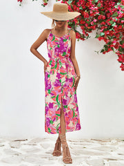 Floral print button-down midi dress with spaghetti straps and a front slit.