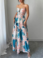 Tropical floral maxi dress with tiered skirt and tie-front bodice.