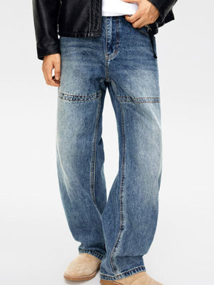Men's relaxed fit blue denim jeans with vintage wash and double-knee detail.