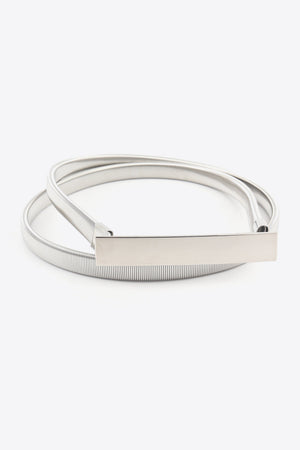 Silver slimline elastic waist belt with a rectangular buckle.