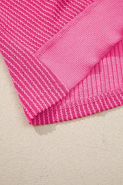 Pink ribbed maternity t-shirt with contrasting band detail and wavy hem.