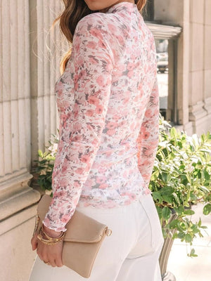 Blush pink floral mesh second-skin top with long sleeves and a mock neck.