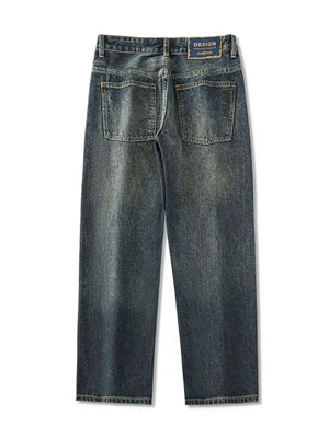 Relaxed fit vintage wide-leg jeans in blue denim with distressed wash and back pockets.