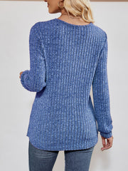 Cobalt blue textured ribbed V-neck pullover sweater with long sleeves.