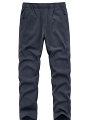 Plus size men's blue sweatpants with elastic waistband and zippered pockets.