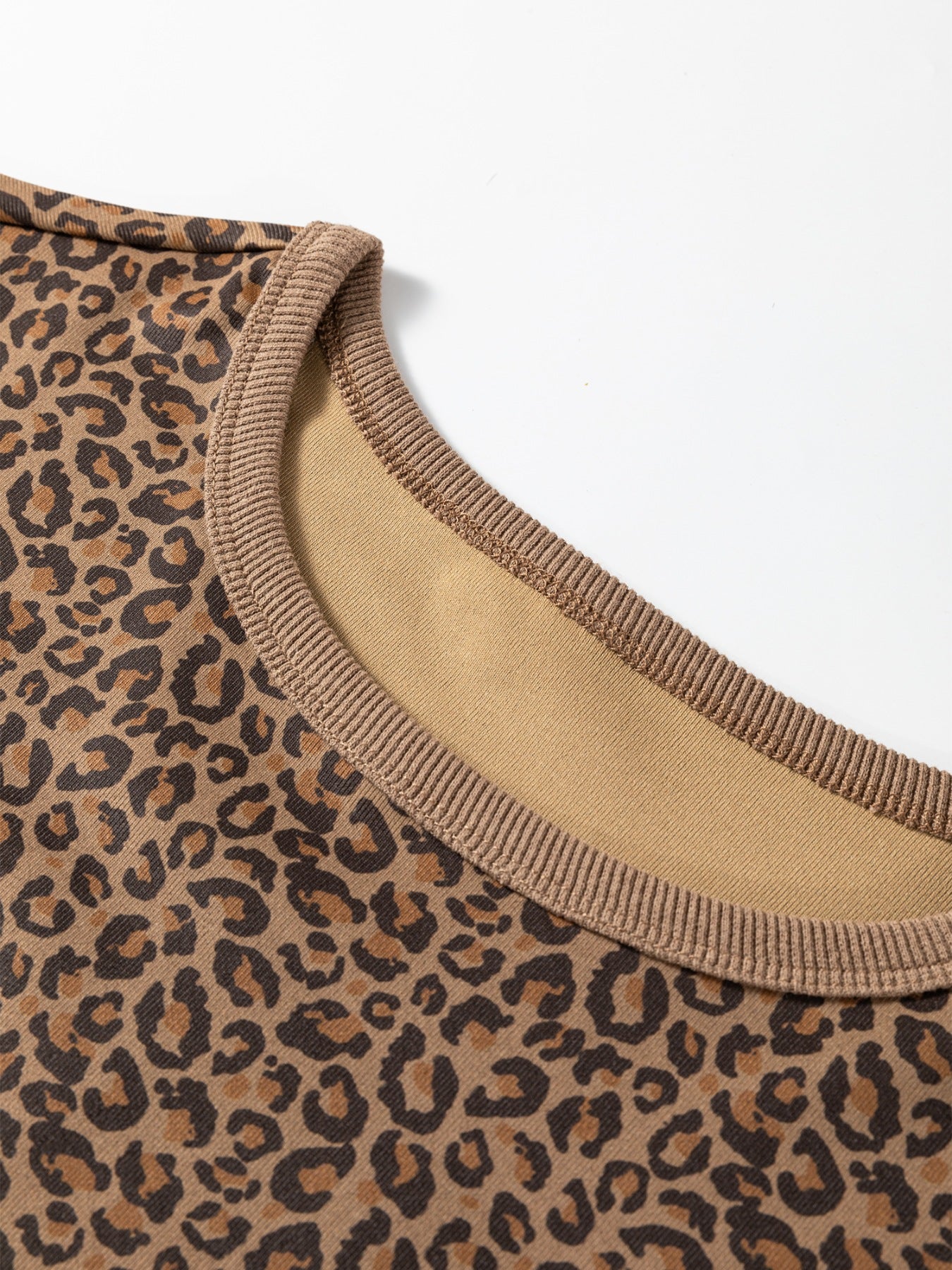 Leopard print relaxed fit t-shirt with a brown ribbed crew neck.