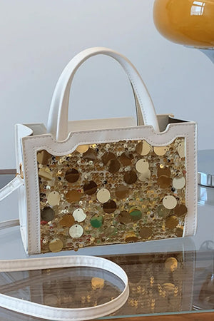 White structured mini bag with gold and iridescent sequins.