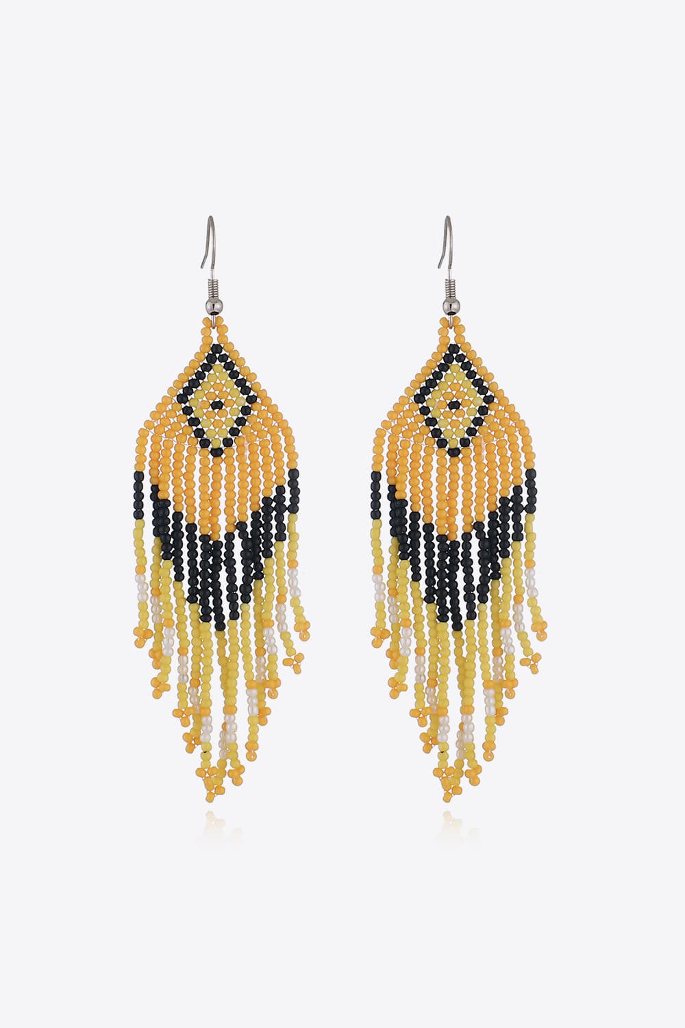 Beaded diamond fringe earrings in yellow, black, and white with boho styling.
